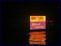 A ship with a large neon advertizement sign on Pearl River